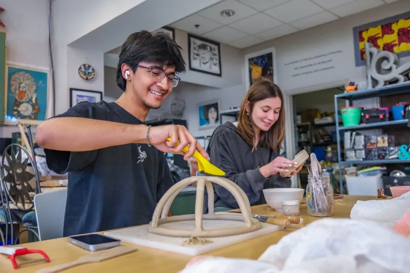 Two students build a model together